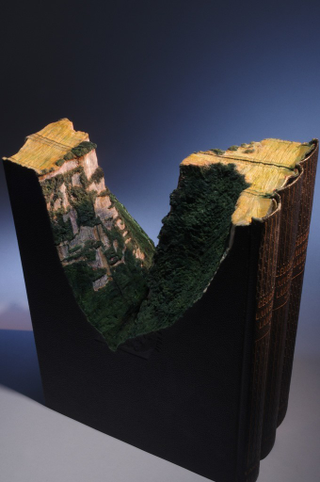 Illustration for article titled This Intricate Landscape Is Carved Into the Encyclopedia Britannica